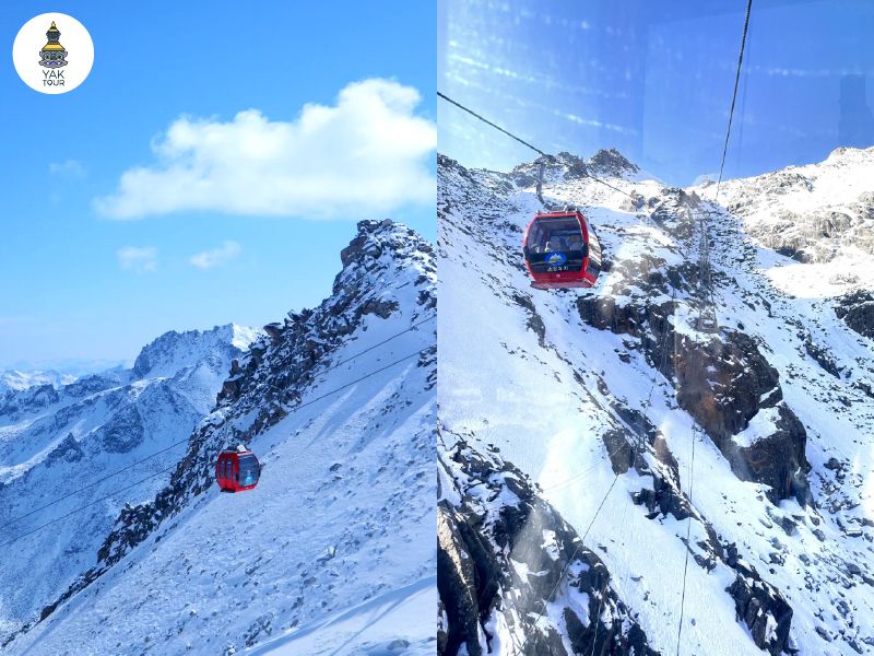 กระเช้าสีแดงไต่ระดับขึ้นสู่ยอดเขาหิมะที่ความสูงกว่า 4,860 เมตรในอุทยานต๋ากู่ปิงชวน